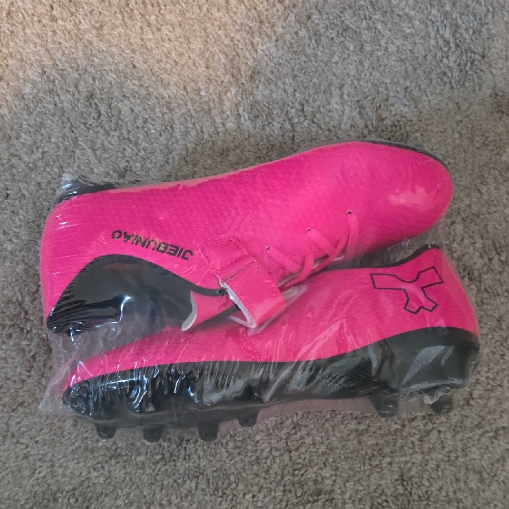 Pink Soccer Cleats with Black Accents